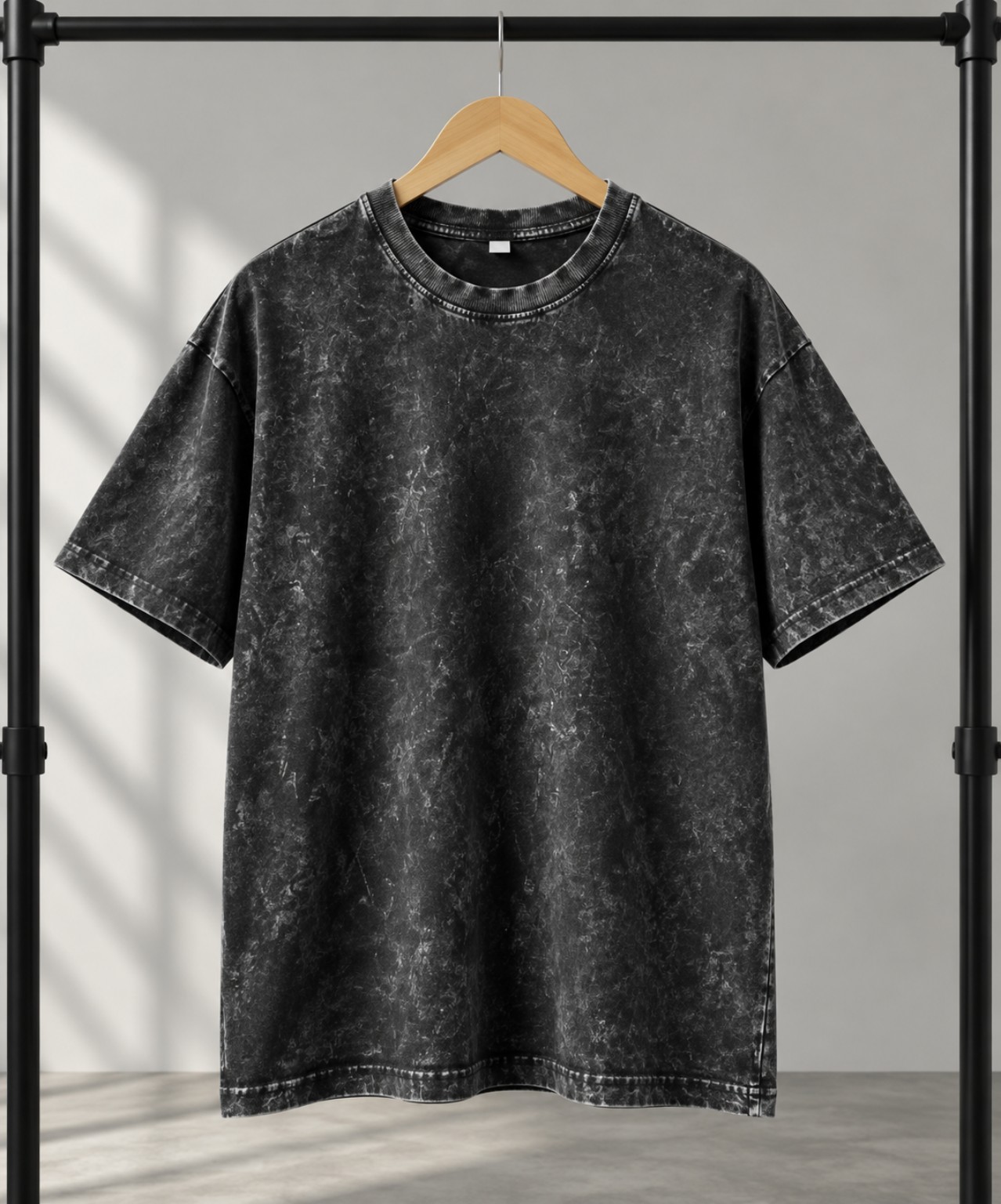 Burgundy acid-wash oversized t-shirt on a hanger