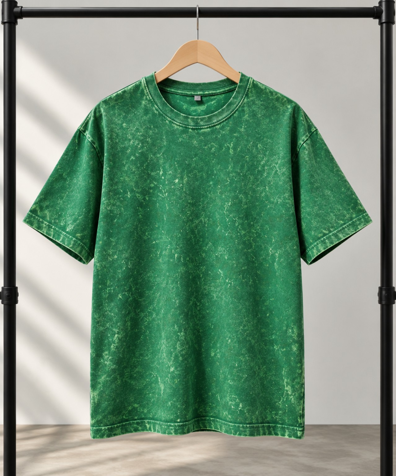 White acid-wash oversized t-shirt on a hanger